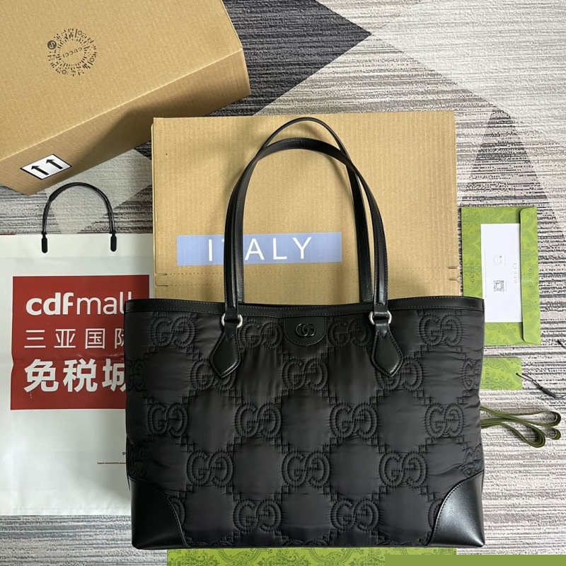 G*u*i shopping bags